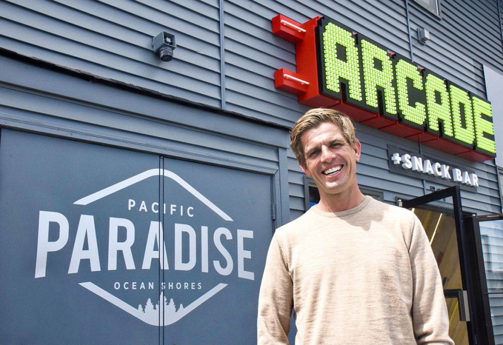 Pacific Paradise Owner James Austin with Exterior Marquee Sign